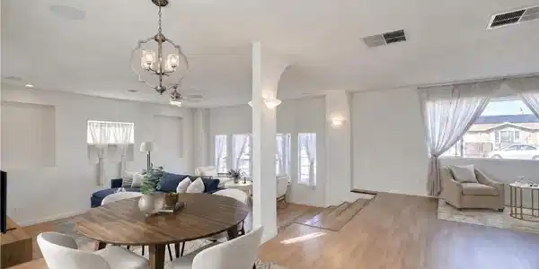 Image 4: An open floorplan seamlessly connects dining and l