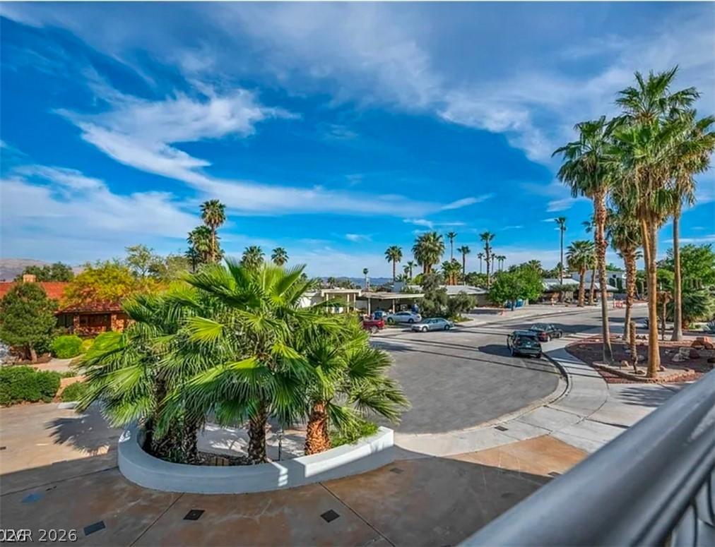 Image 3: A quiet cul-de-sac amidst mature palm trees create