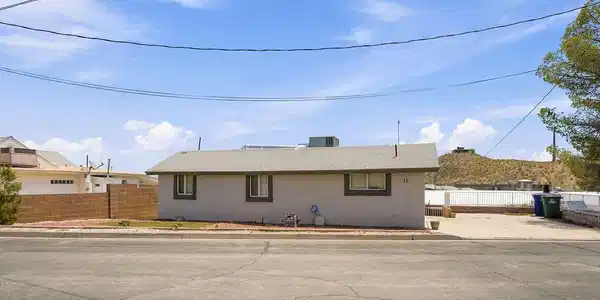 Image 2: Simple dwelling with a practical exterior, nestled