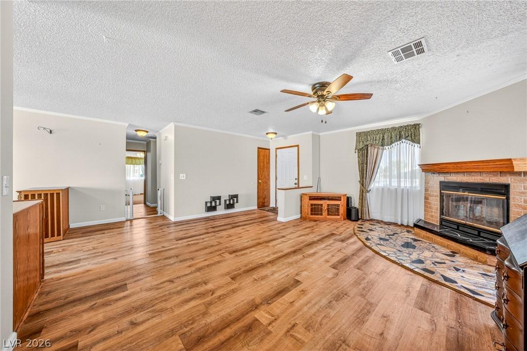 Image 4: A welcoming living area featuring rich hardwood fl