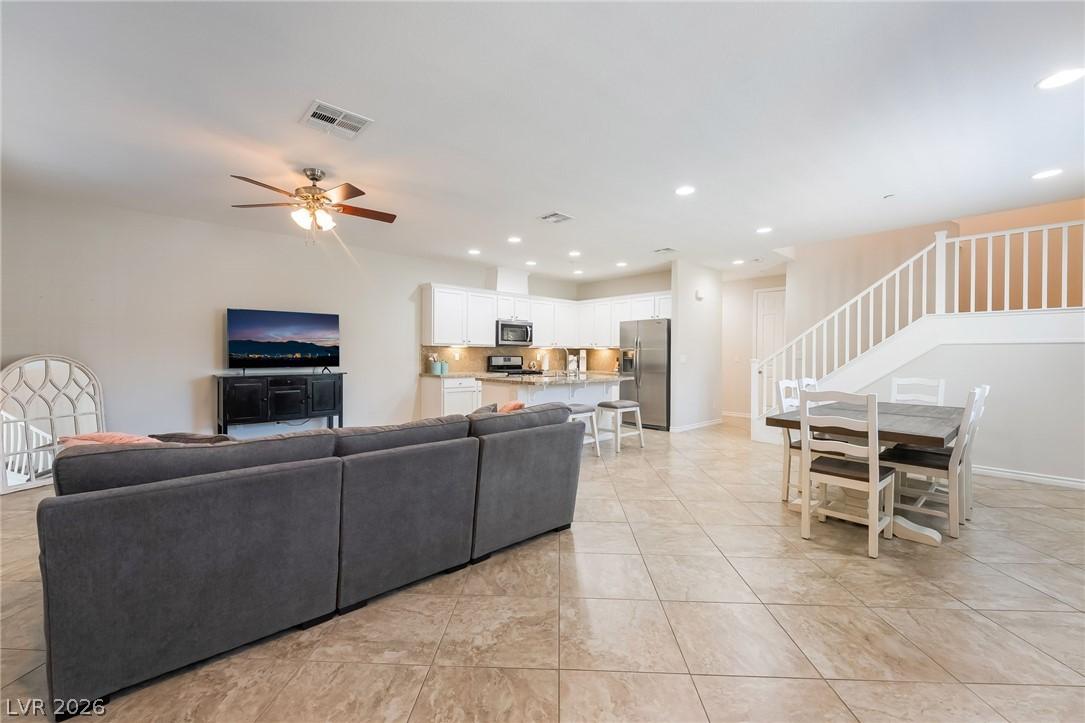 Image 4: An open floorplan seamlessly connects the living r