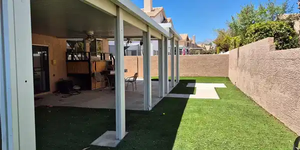 Image 2: An expansive covered patio overlooks the manicured