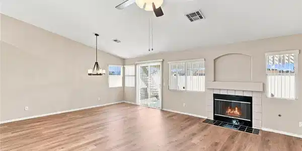 Image 4: Rich wood flooring runs throughout this spacious l