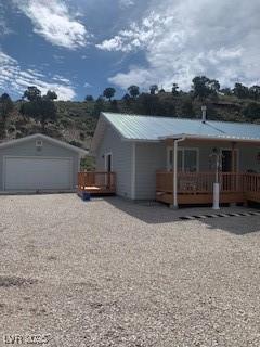 Image 2: View of front of property with a metal roof, a det