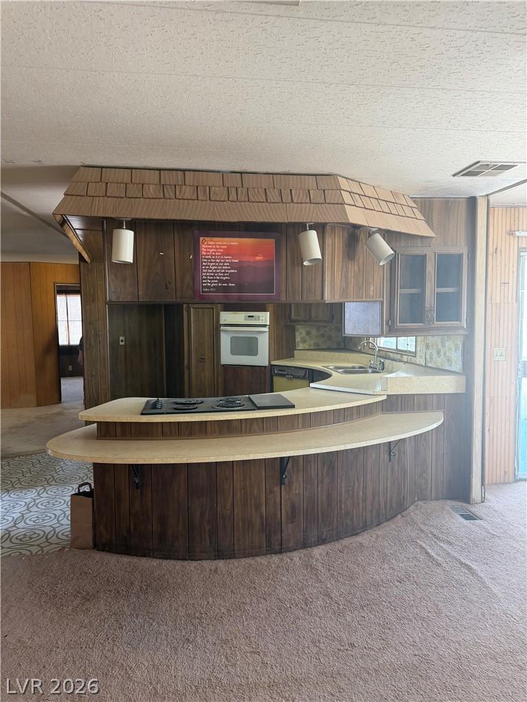 Image 4: A retro-inspired kitchen with a unique breakfast b