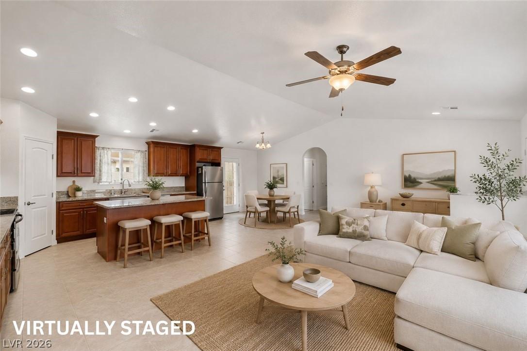 Image 1: Virtually staged open living room/kitchen