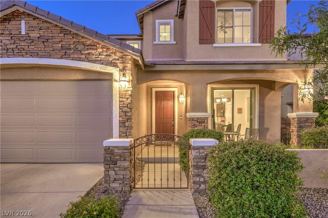 Image 3: Crafted stone accents enhance this home's curb app