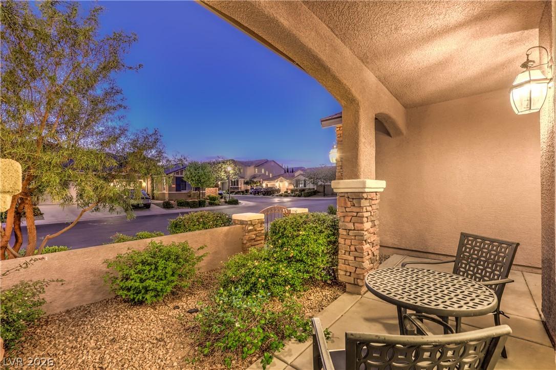 Image 4: An inviting covered patio offers a tranquil evenin