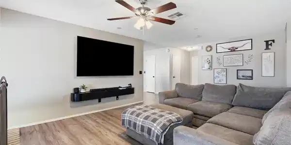 Image 2: A comfortable living space boasts durable LVP floo