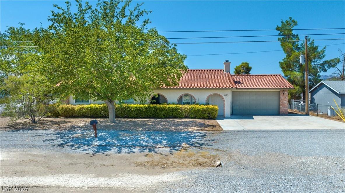 Image 1: A charming single-story residence with a classic r