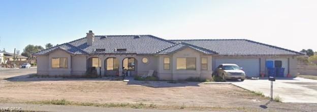 Image 1: A spacious home with a tiled roof, inviting arched