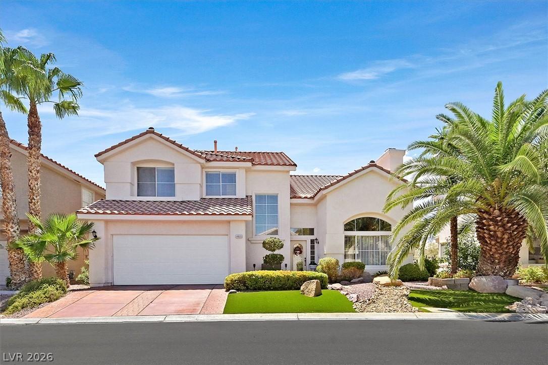 Image 2: A desert oasis with stucco architecture, a tiled r