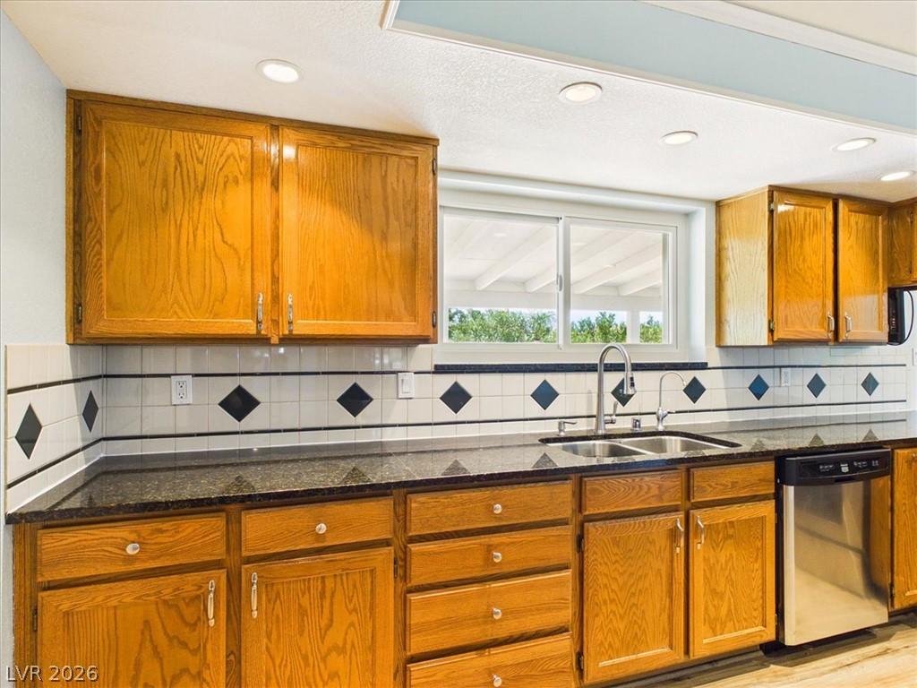 Image 4: A well-equipped kitchen features ample cabinetry,