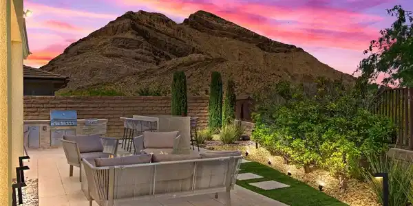 Image 2: An inviting outdoor living space features an integ