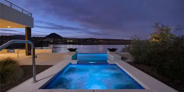Image 2: An elevated spa overlooks the serene lake waters a