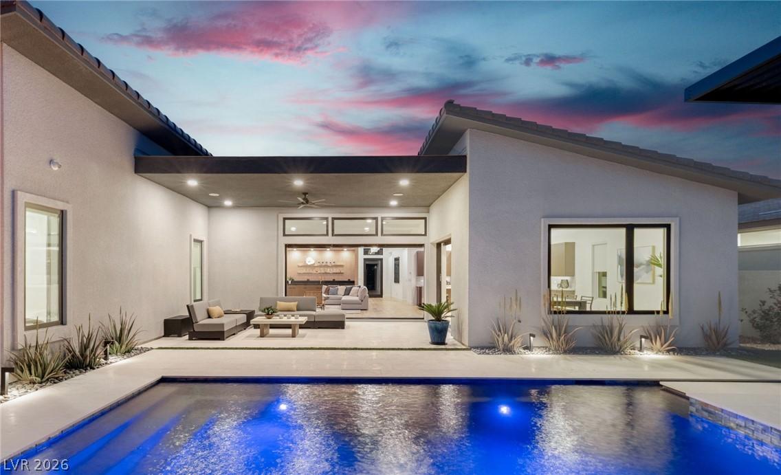 Image 4: This outdoor oasis offers a refreshing pool and an