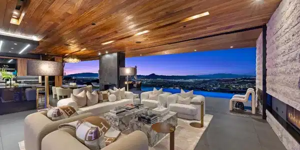 Image 3: An open-concept living space with a wooden ceiling