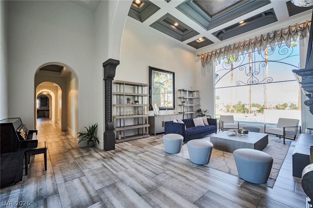 Image 3: Elegant living room with high ceilings, large wind