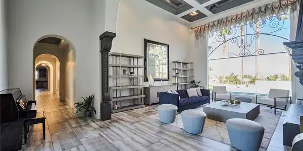 Image 3: Elegant living room with high ceilings, large wind