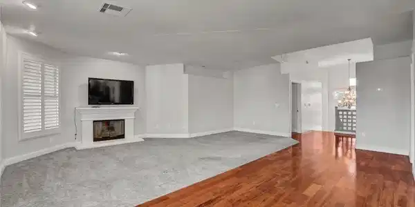 Image 4: Gleaming hardwood floors and a classic fireplace d