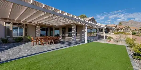 Image 2: An expansive pergola patio cover overlooks majesti