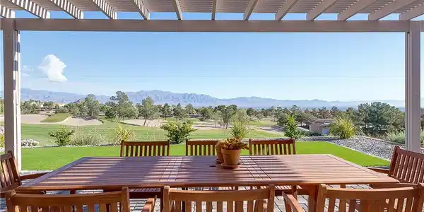 Image 3: A pergola covered patio set high on the golf cours