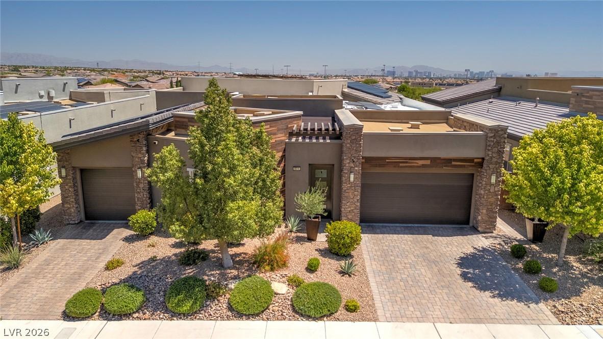 Image 1: This modern desert home features clean lines, ston
