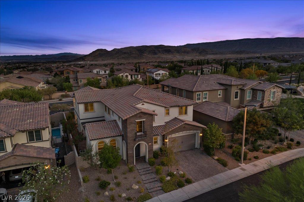Image 1: An aerial perspective reveals a contemporary resid