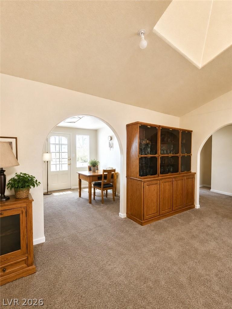 Image 4: Virtually Staged. Archways gracefully define disti