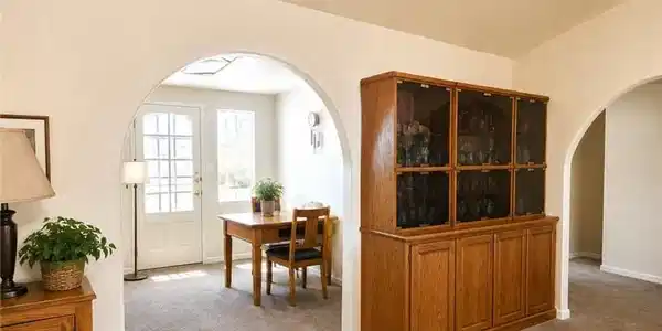 Image 4: Virtually Staged. Archways gracefully define disti