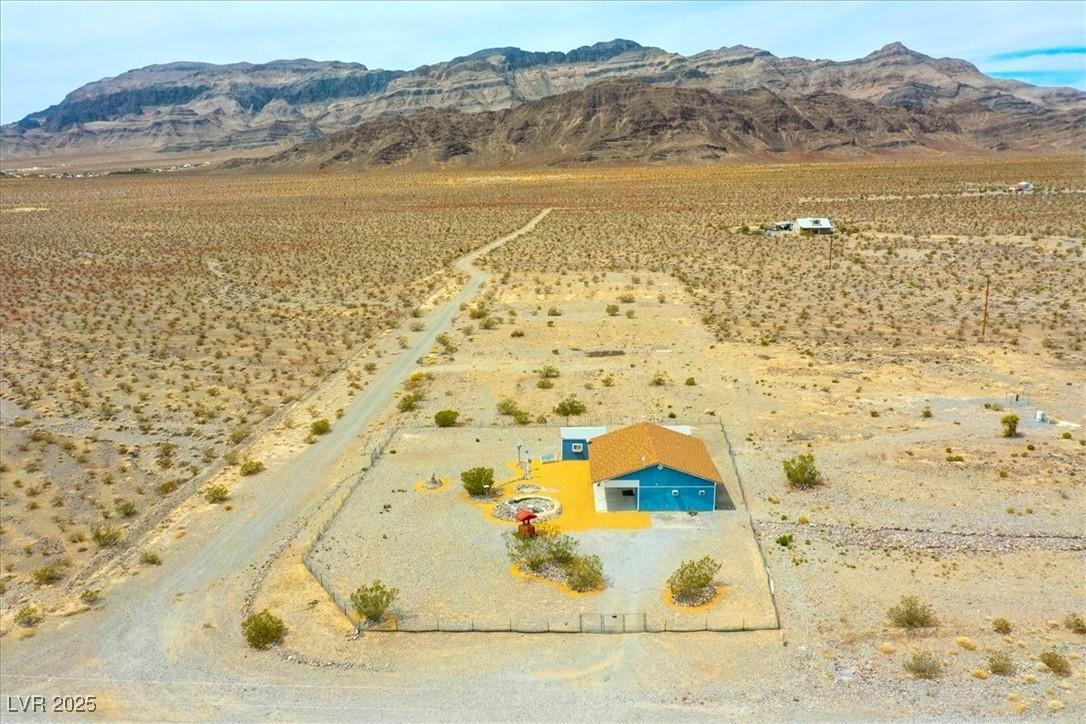 Image 3: View of rural area featuring a mountainous backgro
