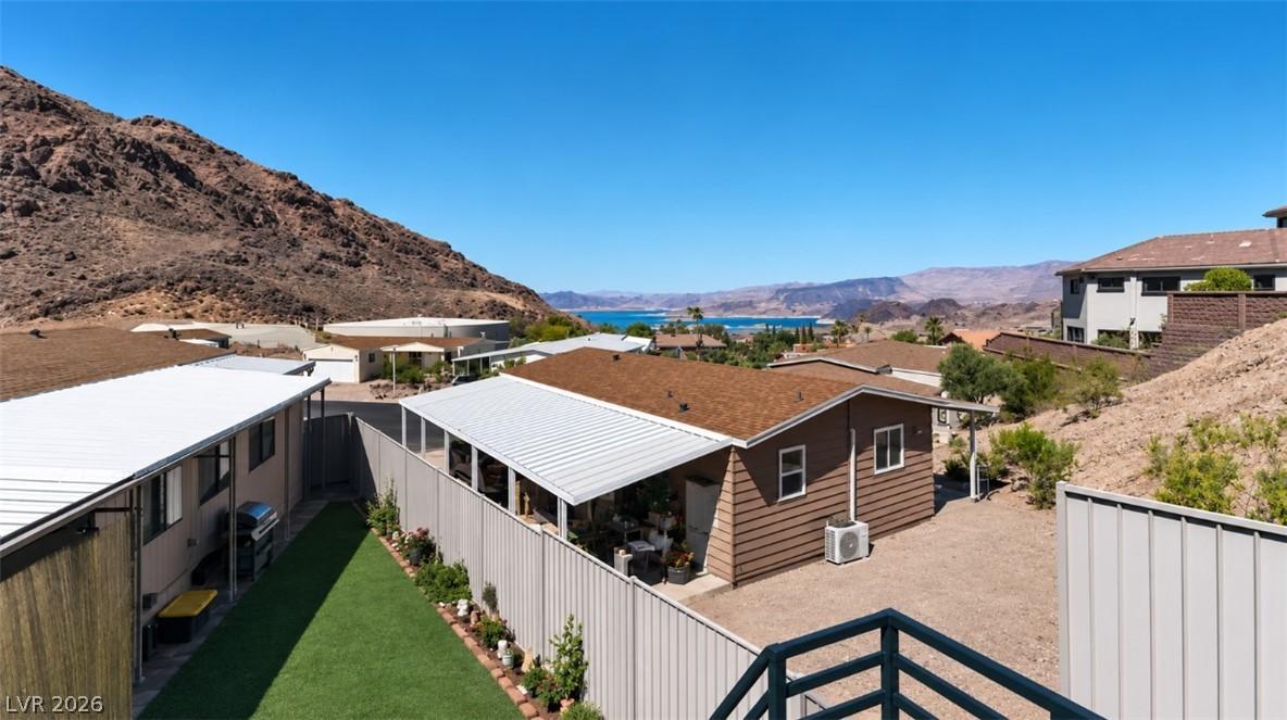 Image 2: Perched above the lake, this property presents a s