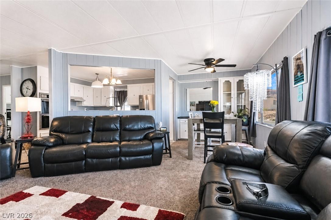 Image 3: An open concept living and dining area boasts a ki