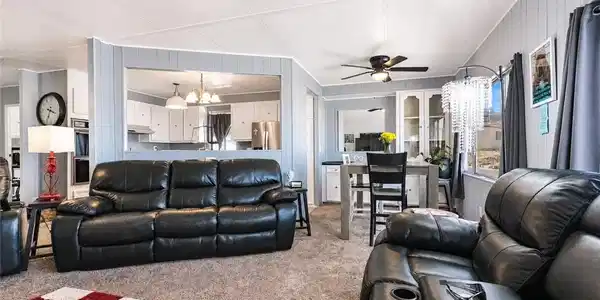 Image 3: An open concept living and dining area boasts a ki