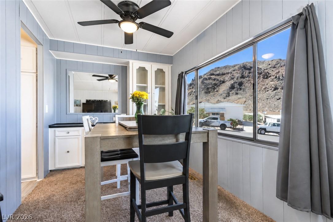 Image 4: A casual dining space features a window framing a