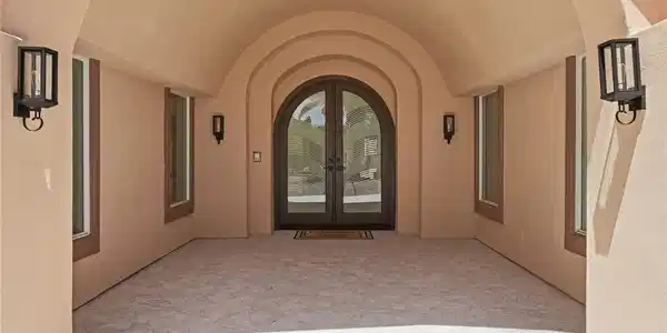 Image 4: Arched entryways and textured flooring define this