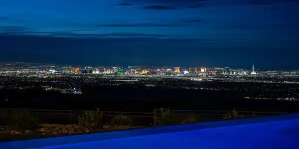 Image 3: Glittering city lights stretch across the horizon