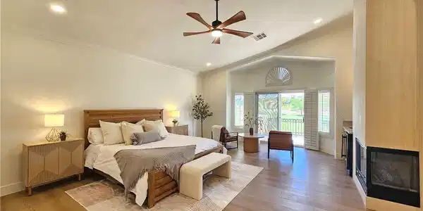 Image 4: High vaulted ceilings and wood floors frame this e