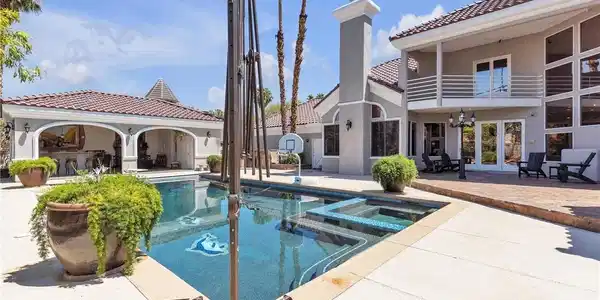 Image 2: A tiled swimming pool and integrated spa anchor th