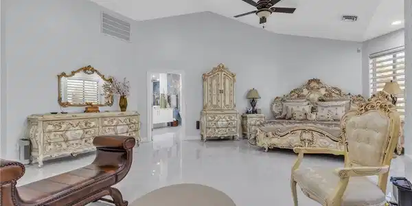 Image 4: Gleaming tile floors and vaulted ceilings define t