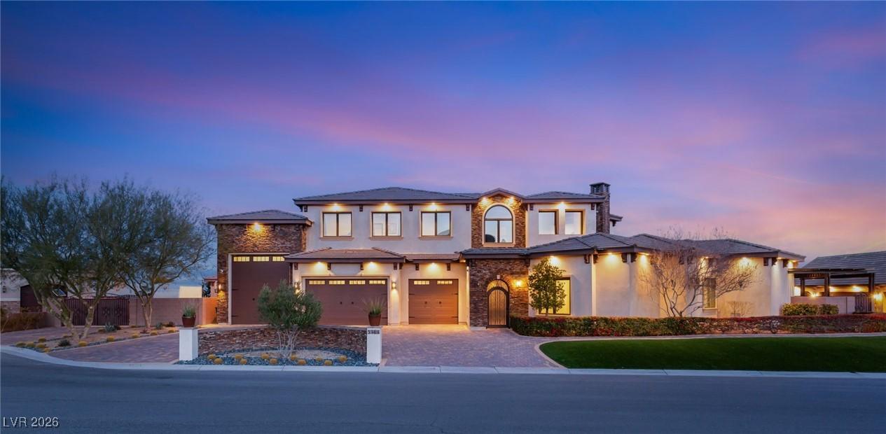 Image 1: View of front of house featuring stucco siding, st