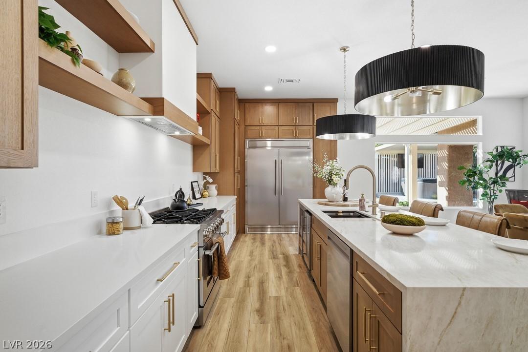 Image 3: Culinary delights await in this bright kitchen, sh