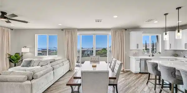 Image 2: An open-concept interior boasts sleek flooring, br