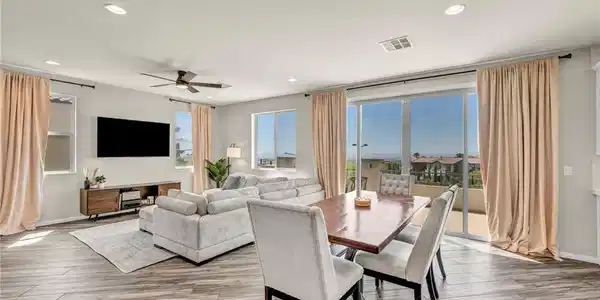 Image 4: Natural light floods this inviting living space, o
