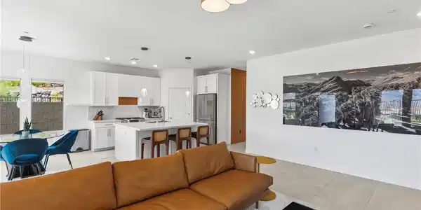 Image 4: An open-concept living area flows seamlessly into