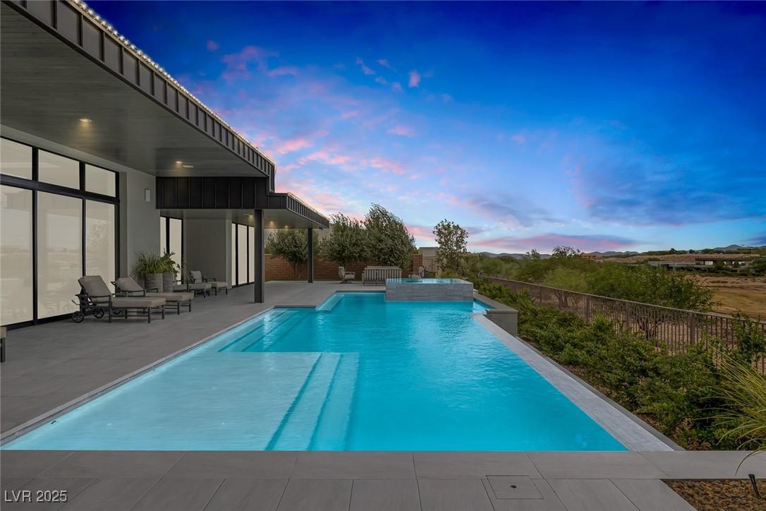 Image 3: View of swimming pool featuring a fenced backyard,