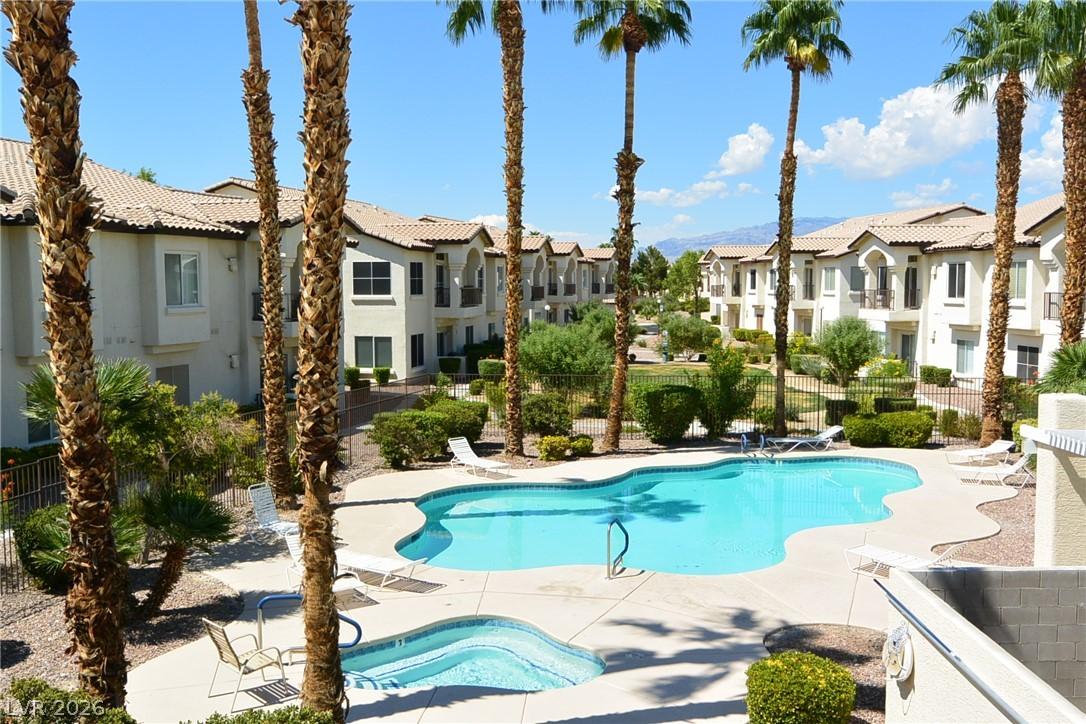Image 2: Two refreshing community pool & spas invite relaxa