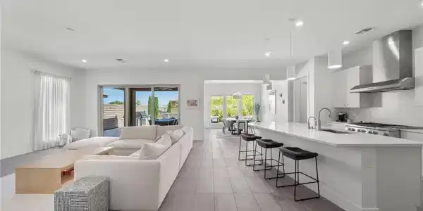 Image 4: An open-concept living space integrates a well-app