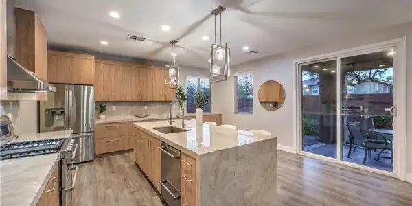 Image 2: Sliding glass doors connect this modern culinary s