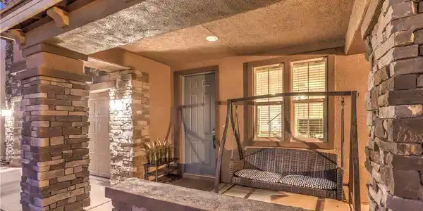 Image 4: An inviting entryway welcomes guests with rustic s